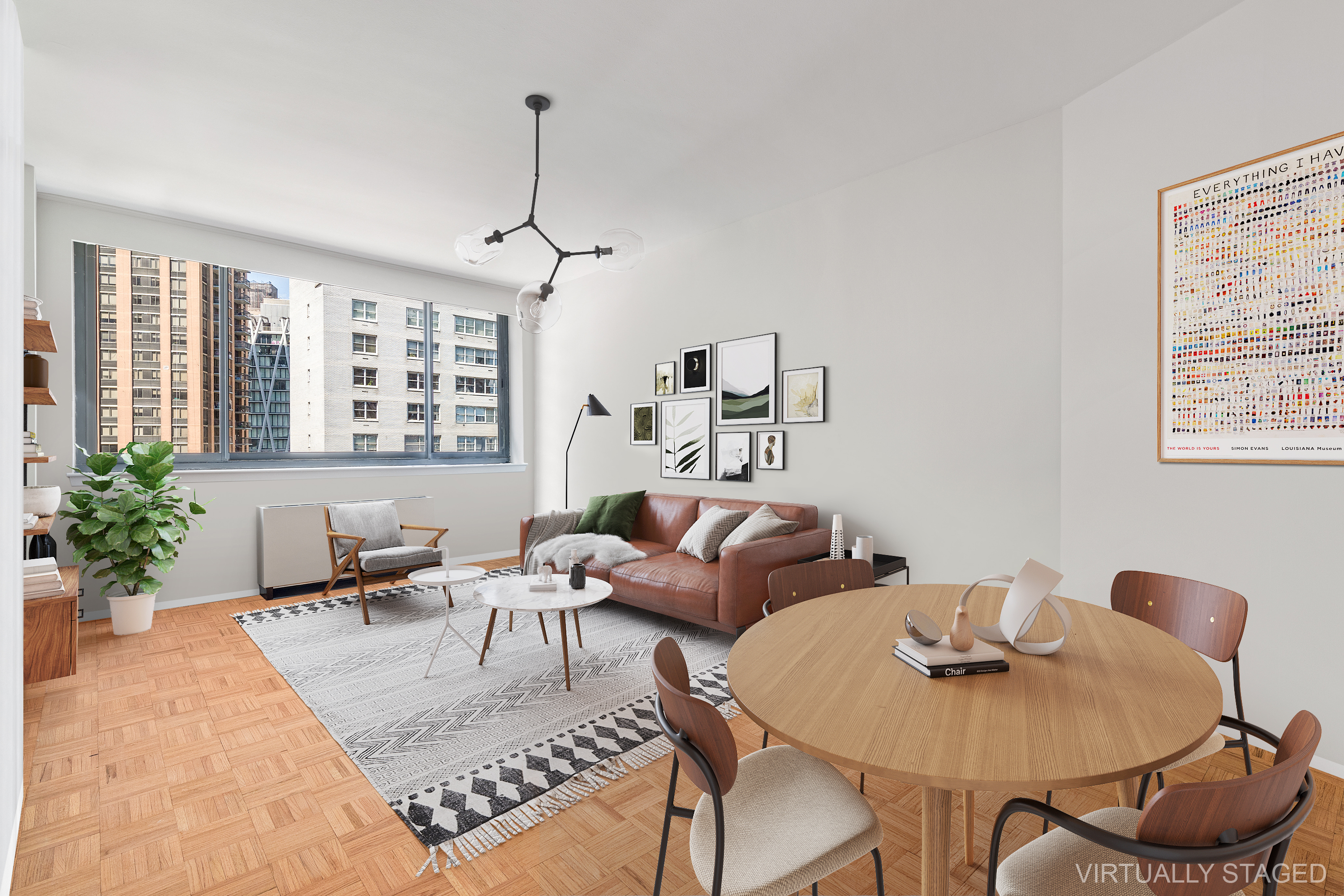 a living room with furniture a window and a potted plant