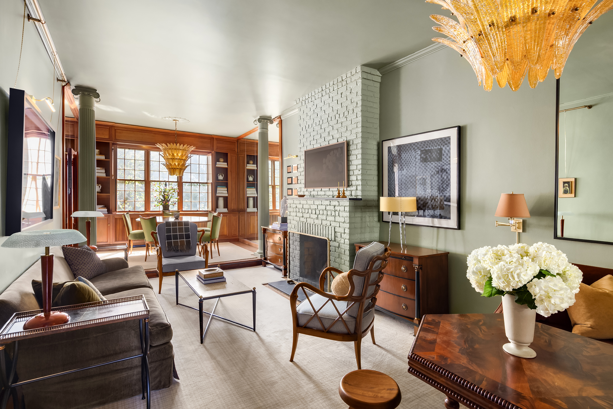 159 West 13th Street Manhattan, NY 10011 - Photo 22 of 36 a living room with furniture fireplace and a large window