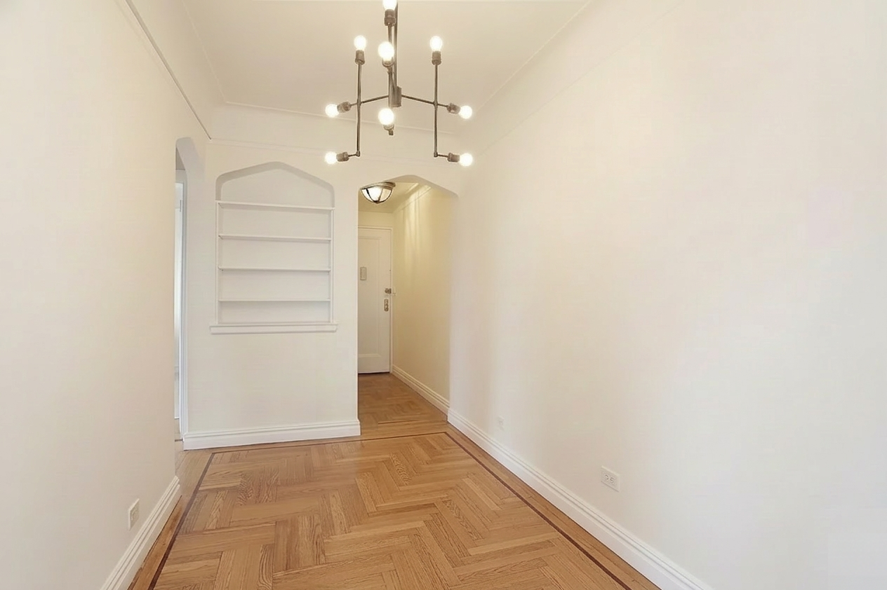 250 Cabrini Boulevard, Unit 9E Manhattan, NY 10033 - Photo 7 of 19 a view of a hallway with wooden floor