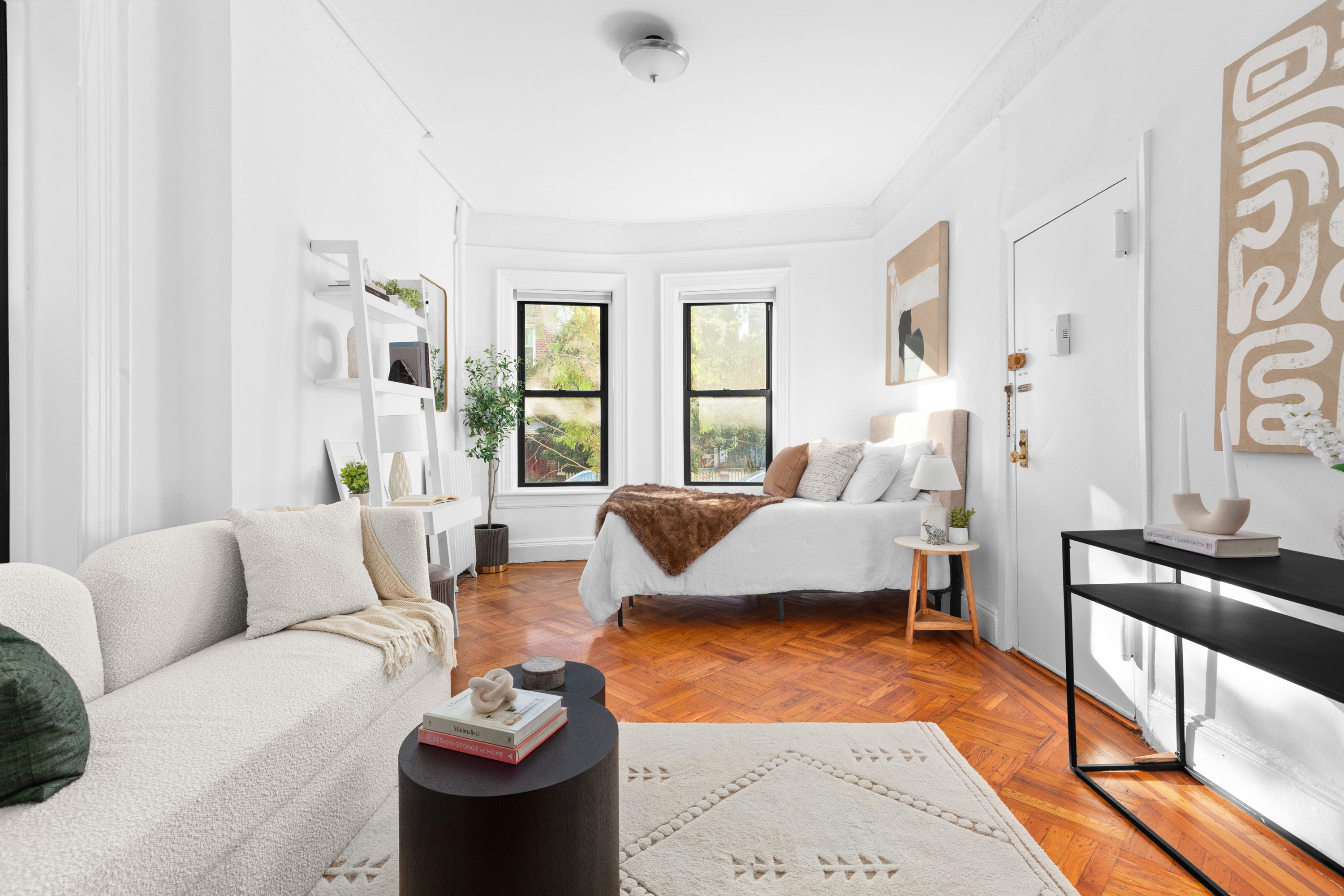 47 Reeve Place, Unit 1 Brooklyn, NY 11218 - Photo 1 of 8 a living room with furniture and a large window