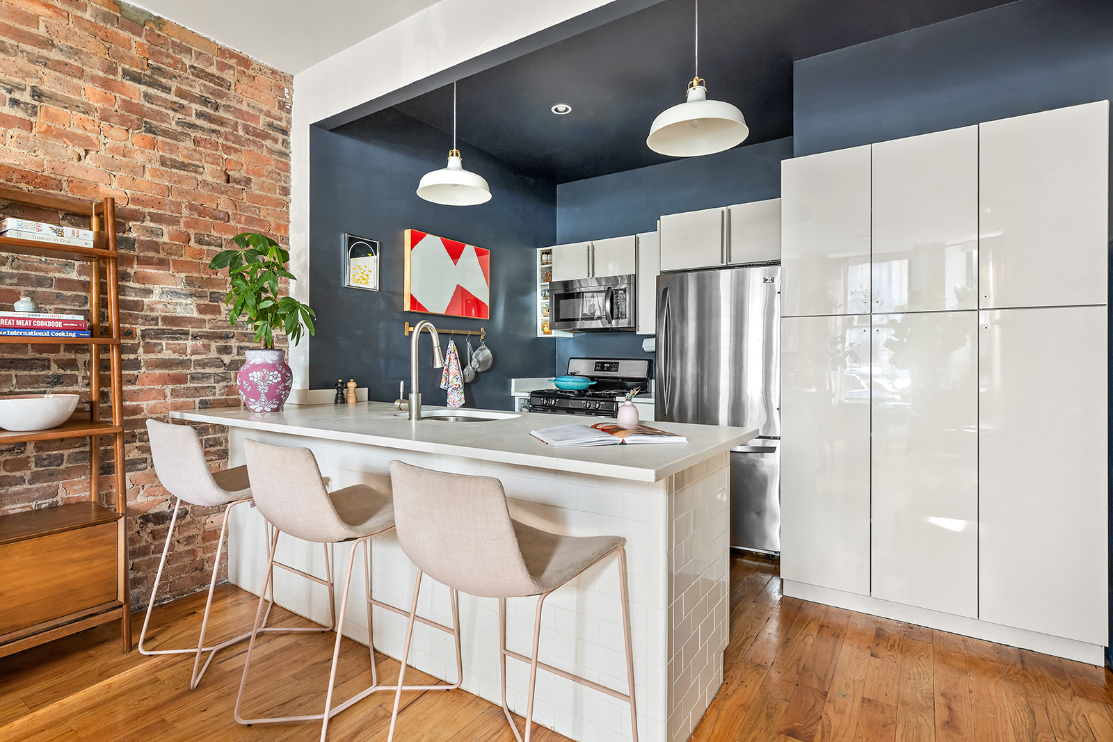 1153 Pacific Street, Unit 1 Brooklyn, NY 11216 - Photo 2 of 11 a kitchen with stainless steel appliances granite countertop a sink cabinets and wooden floor