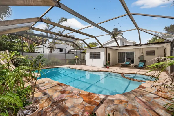a view of a house with swimming pool