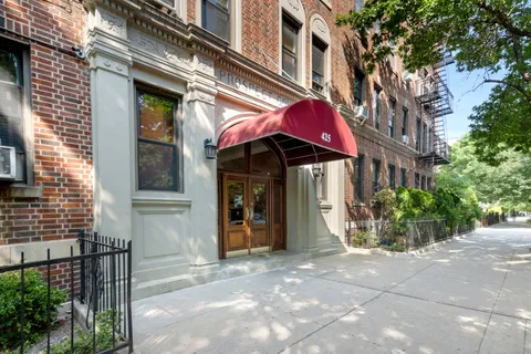 a view of a building with sitting area