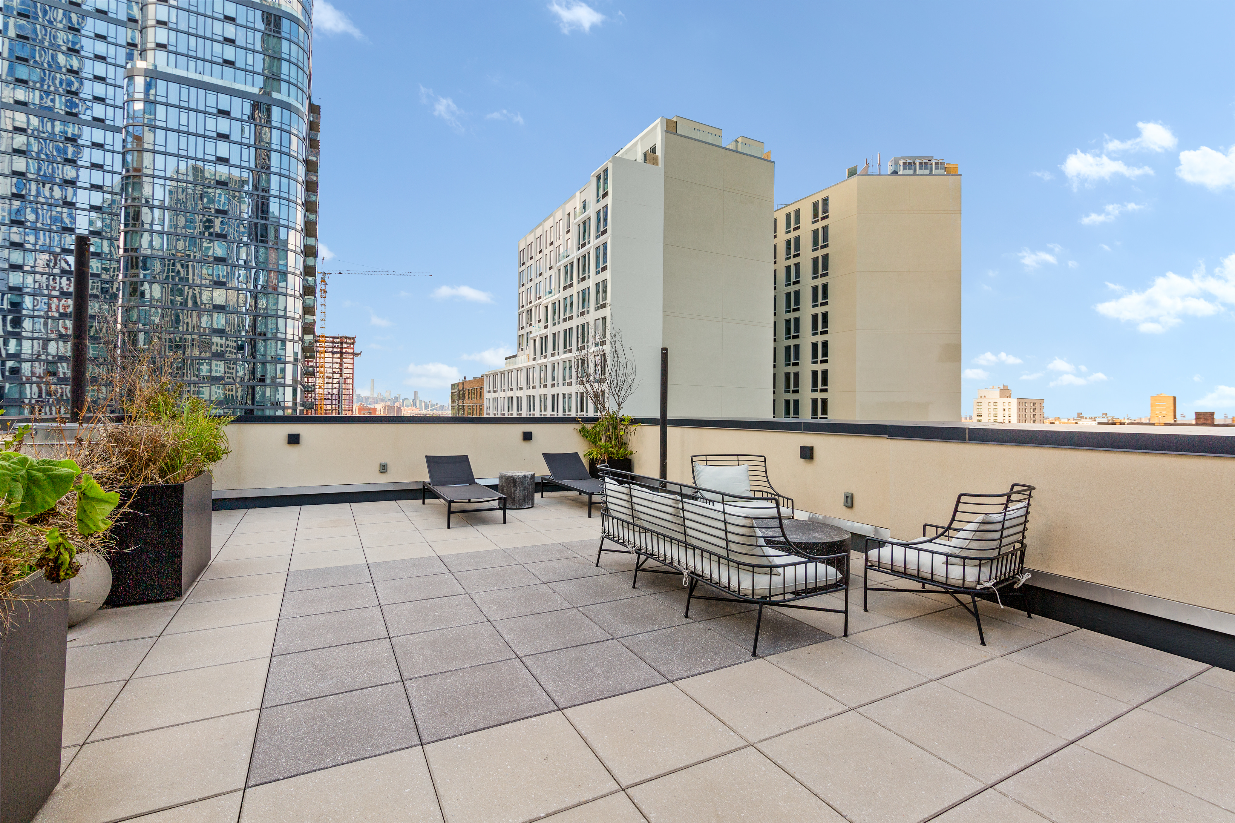 112 Fleet Place, Unit 12A Brooklyn, NY 11201 - Photo 13 of 15 a view of a terrace with chairs and a potted plant