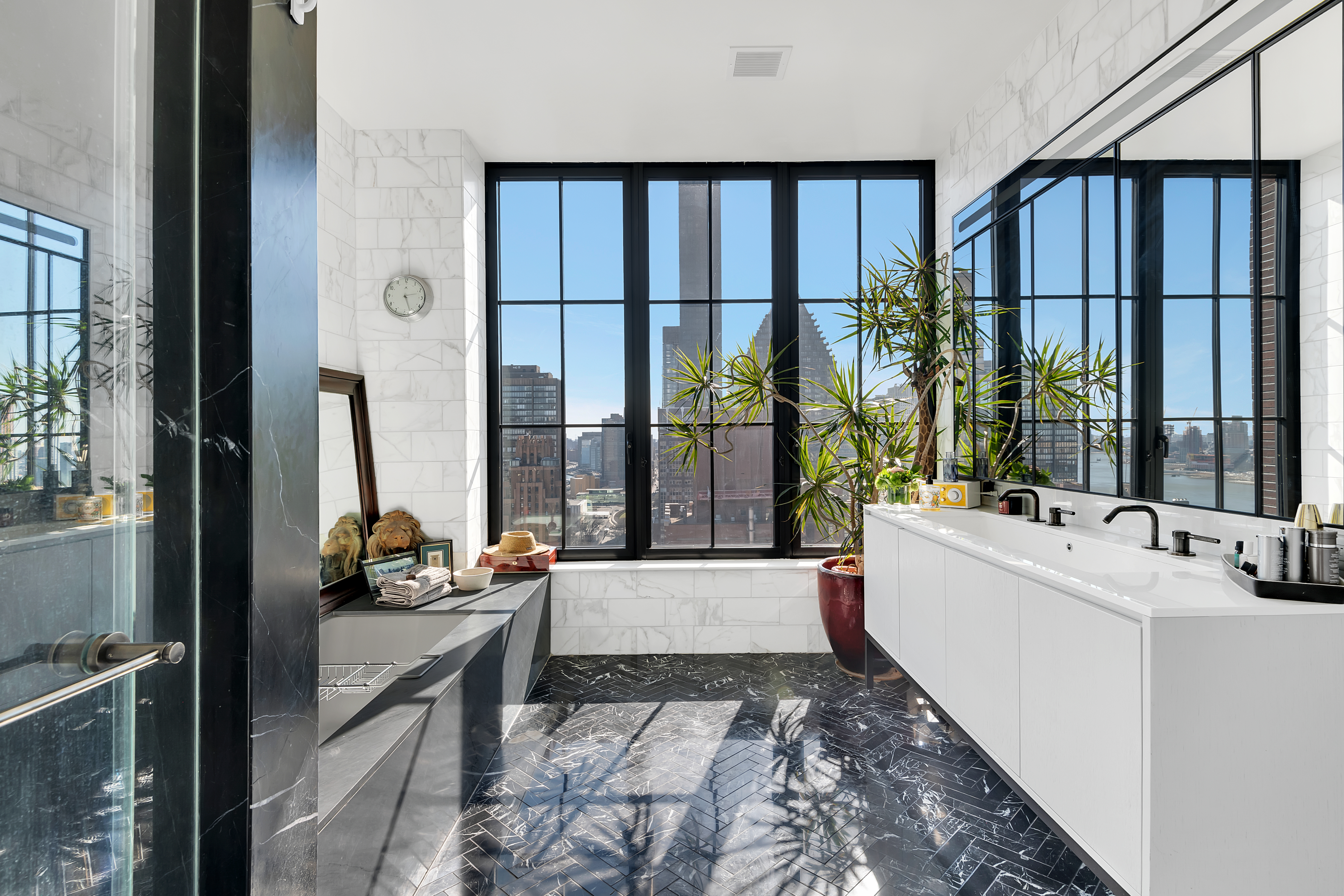 959 1st Avenue, Unit 25H Manhattan, NY 10022 - Photo 8 of 18 a living room with large windows with furniture