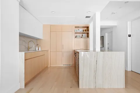 a bathroom with a sink a mirror and a shower