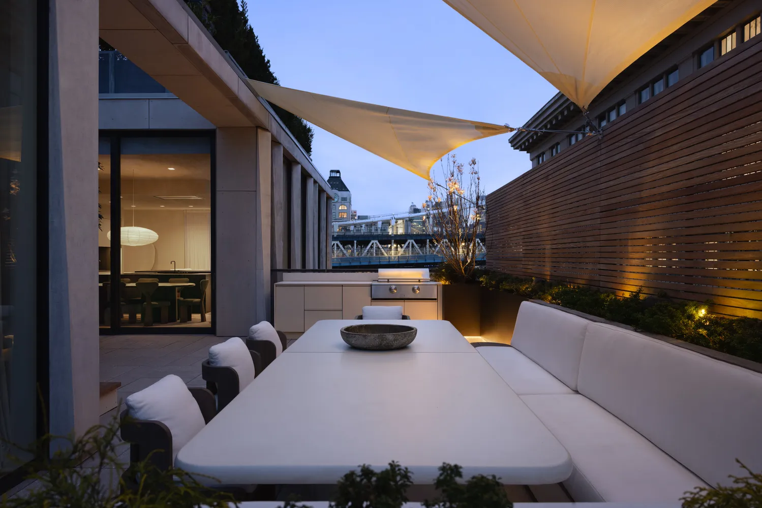 a view of outdoor kitchen outdoor dining space and patio