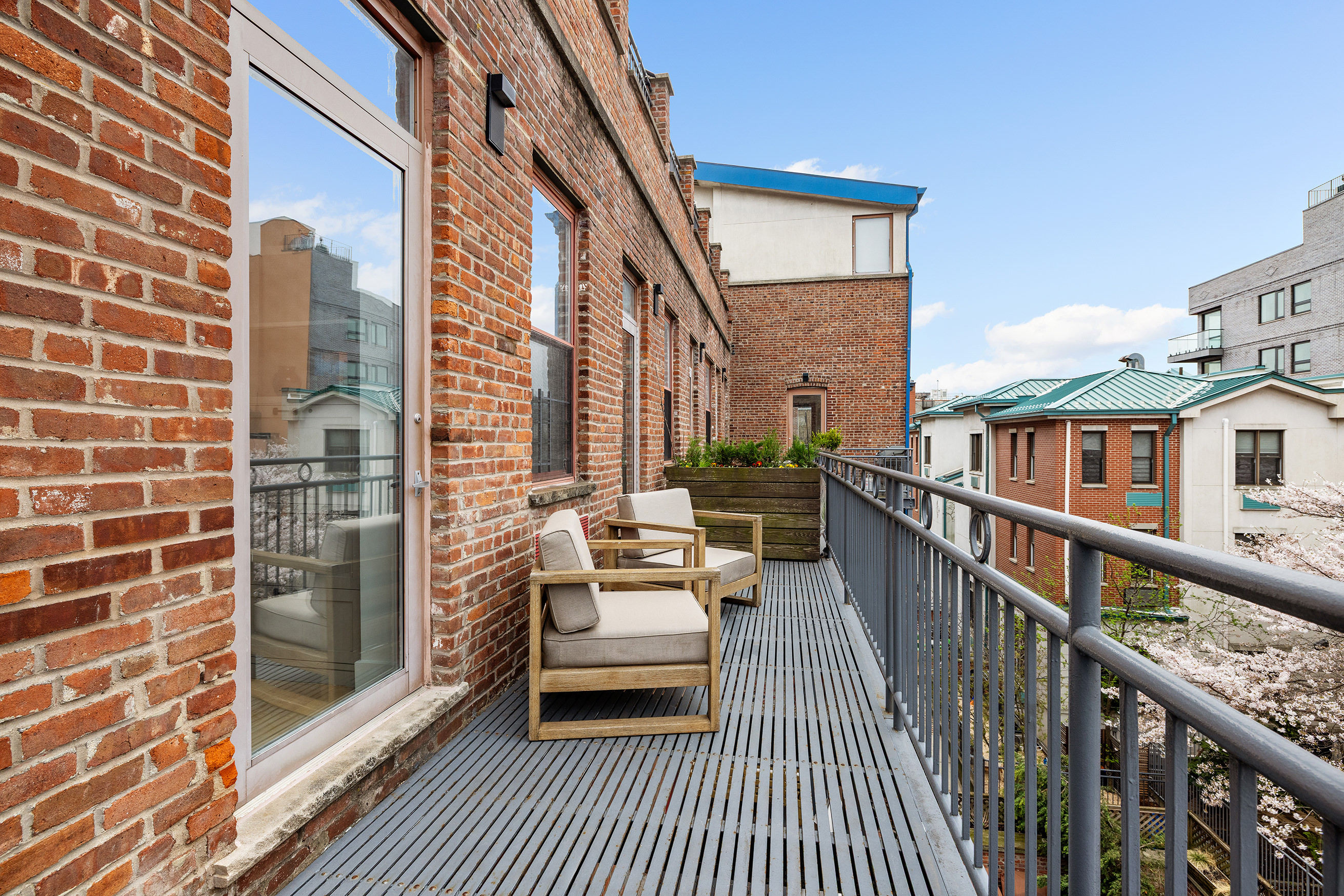 60 Tiffany Place, Unit 3G Brooklyn, NY 11231 - Photo 9 of 10 a balcony with furniture and wooden floor