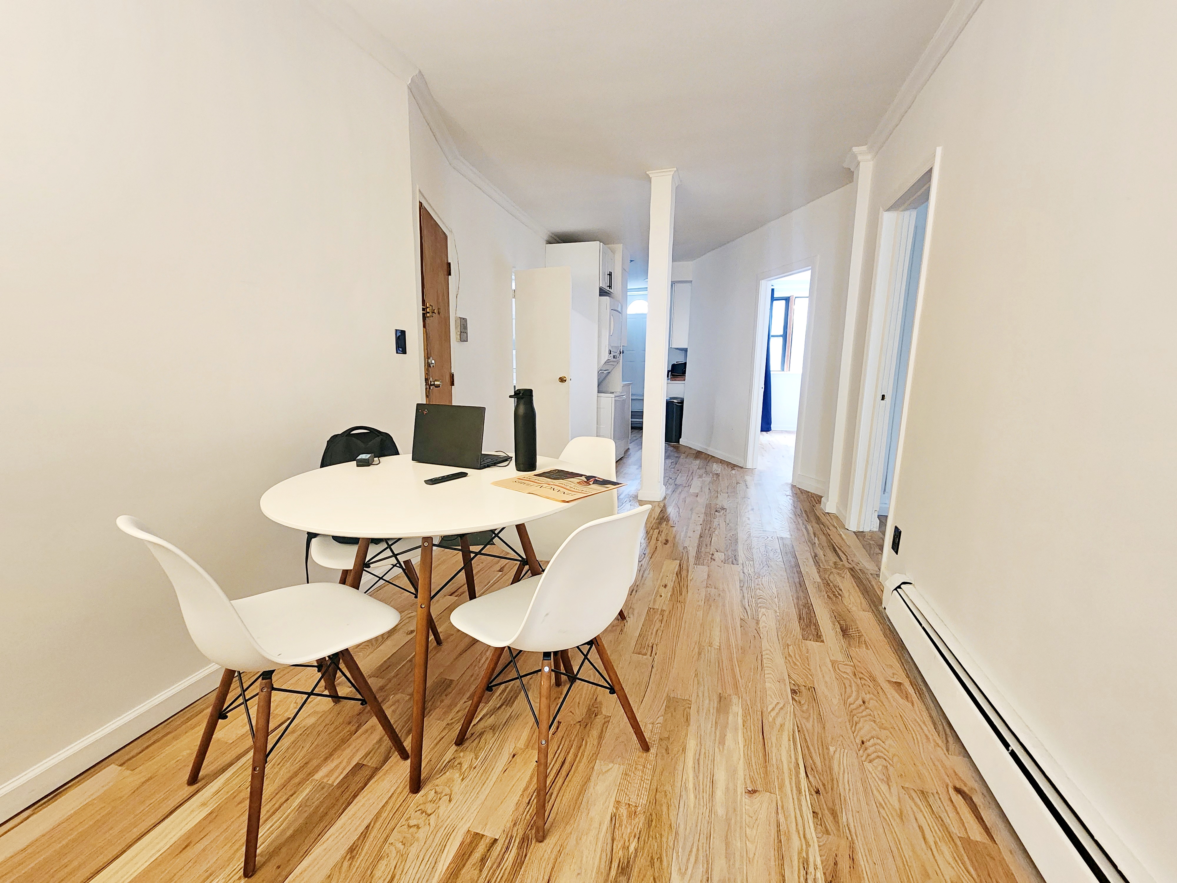258 Devoe Street, Unit 1 Brooklyn, NY 11211 - Photo 9 of 12 a view of a dining room with furniture and wooden floor
