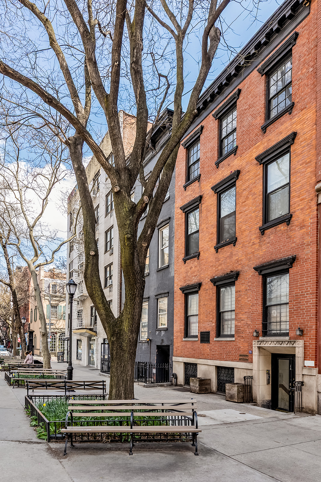 198 6th Avenue Manhattan, NY 10013 - Photo 44 of 45 a front view of a building with large trees