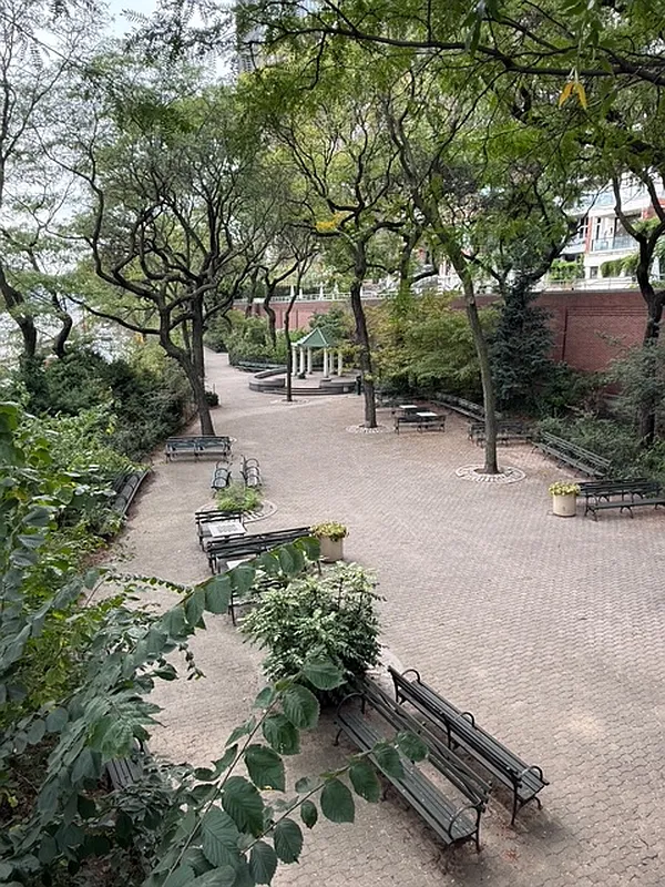 865 1st Avenue, Unit 9C Manhattan, NY 10017 - Photo 11 of 13 a backyard of a house with lots of green space