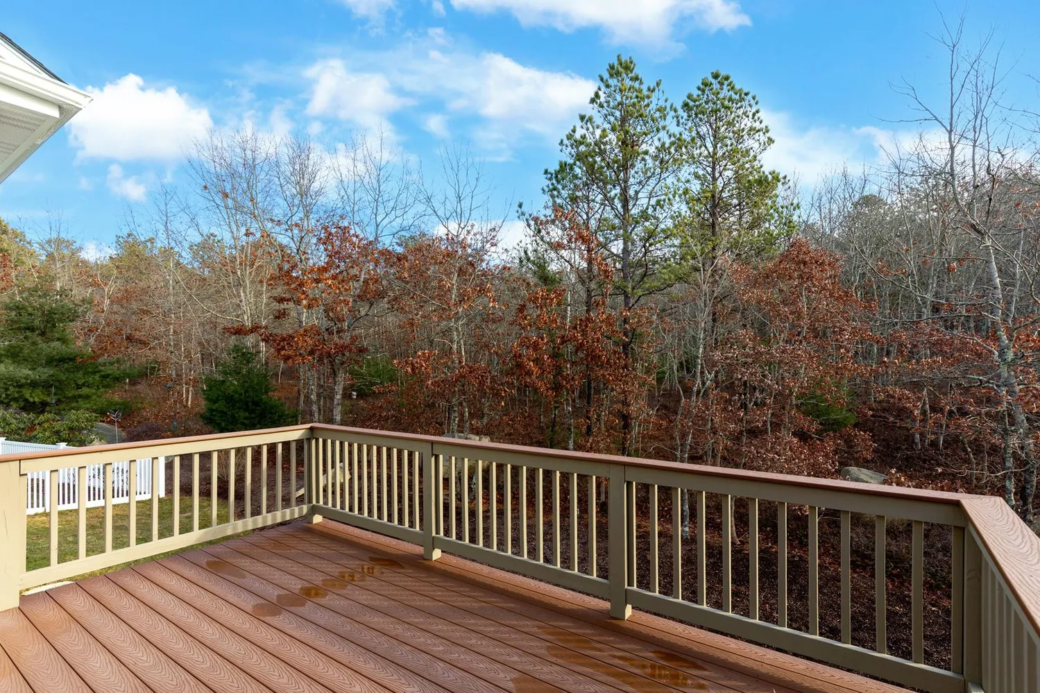 a view of backyard with wooden deck