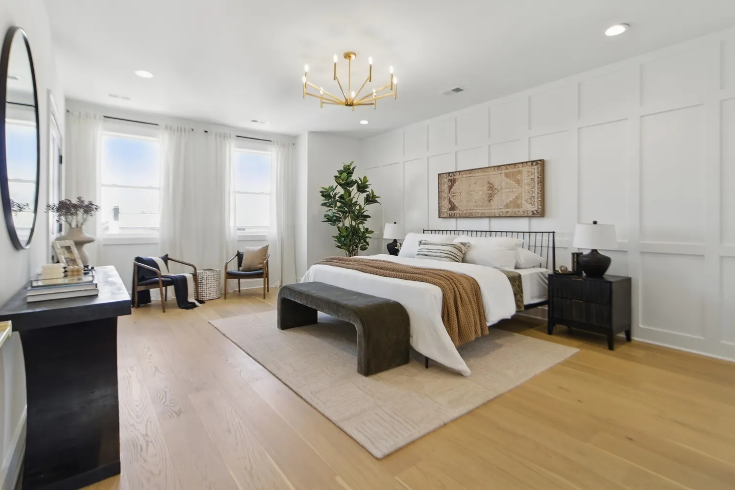 a bedroom with furniture and a chandelier