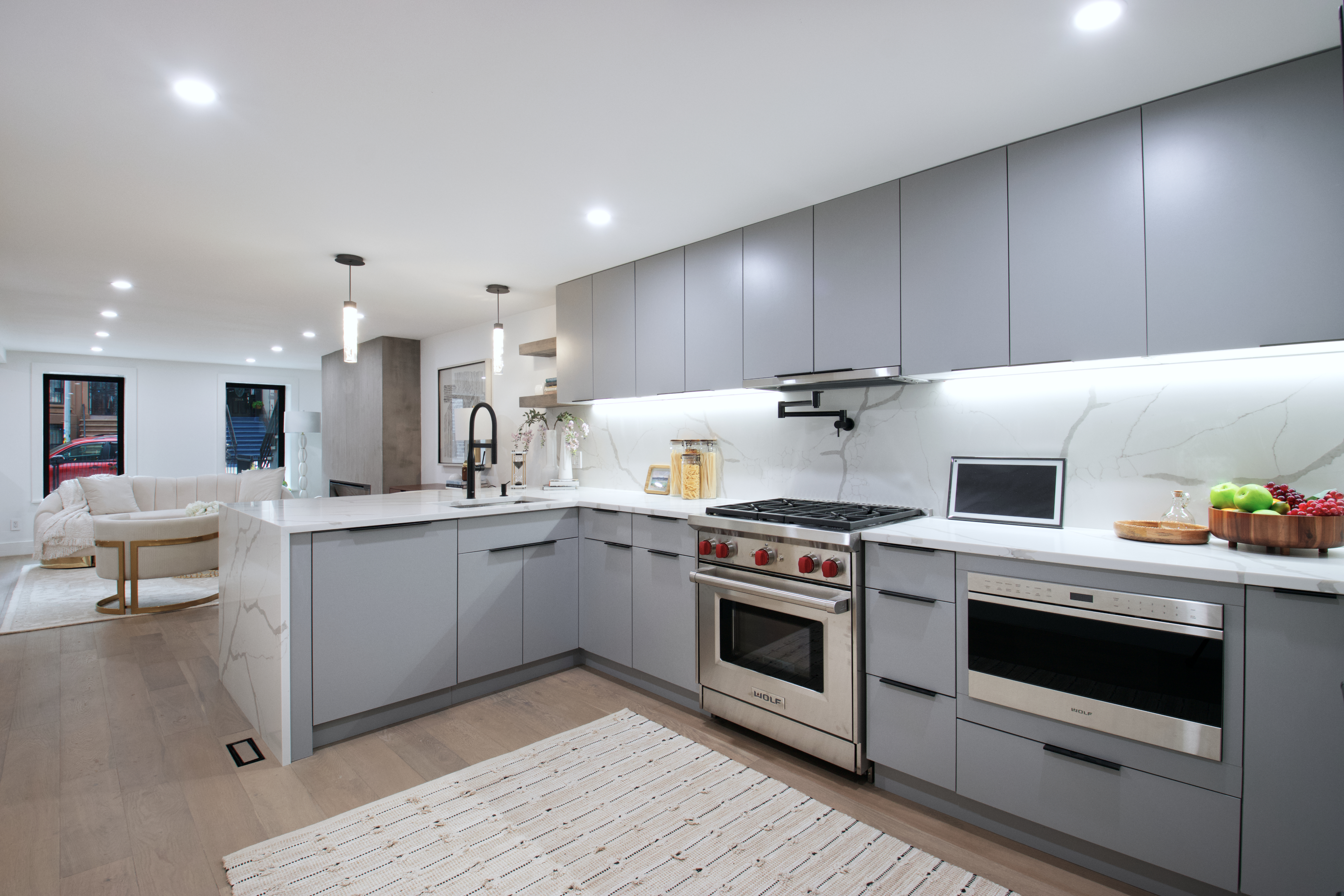 255 Macon Street Brooklyn, NY 11216 - Photo 3 of 36 a kitchen with a stove and white cabinets
