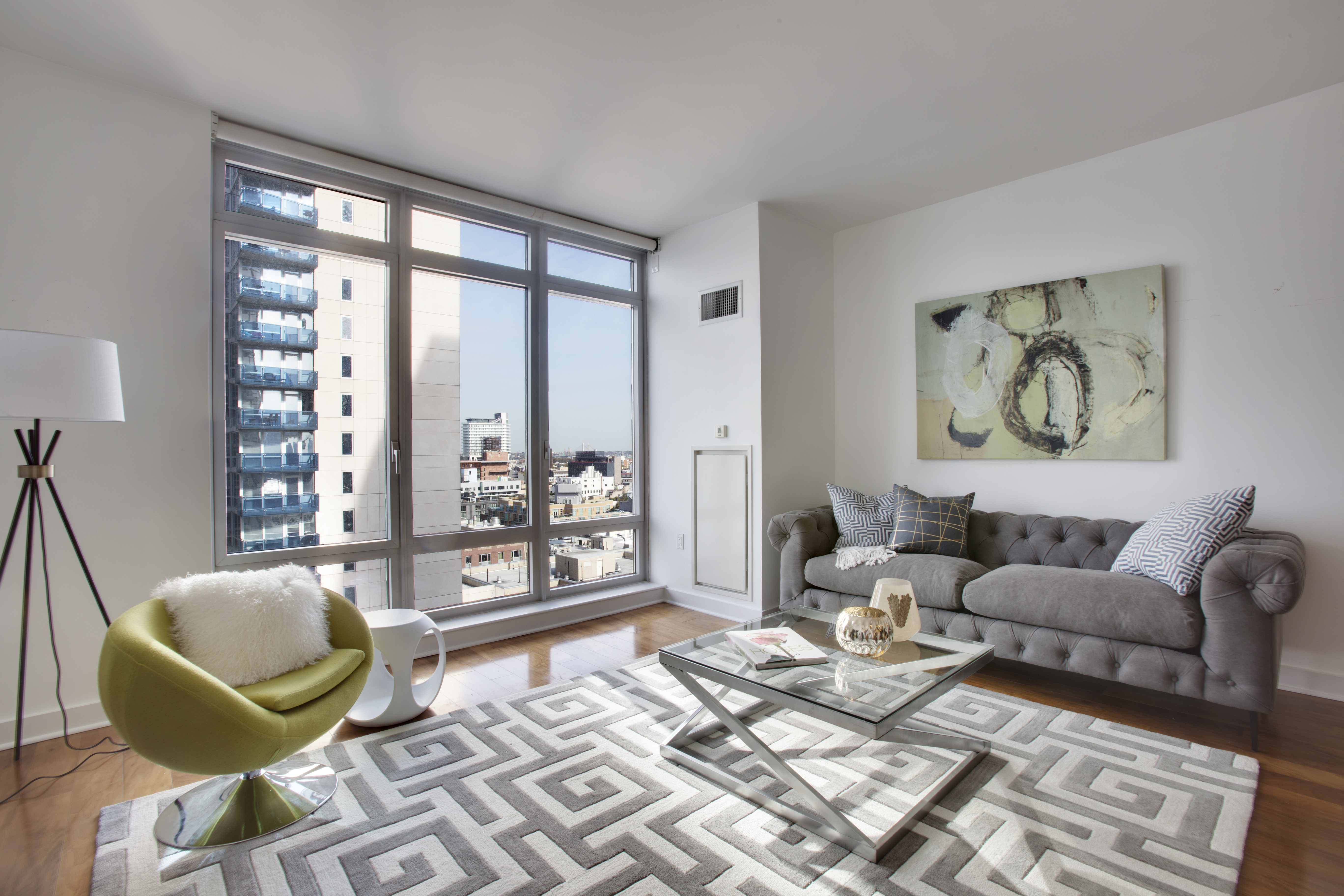 2 Northside Piers, Unit 8H Brooklyn, NY 11249 - Photo 5 of 20 a living room with furniture and a large window