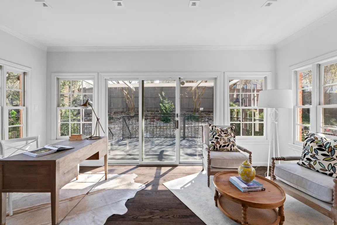 a living room with furniture and large window
