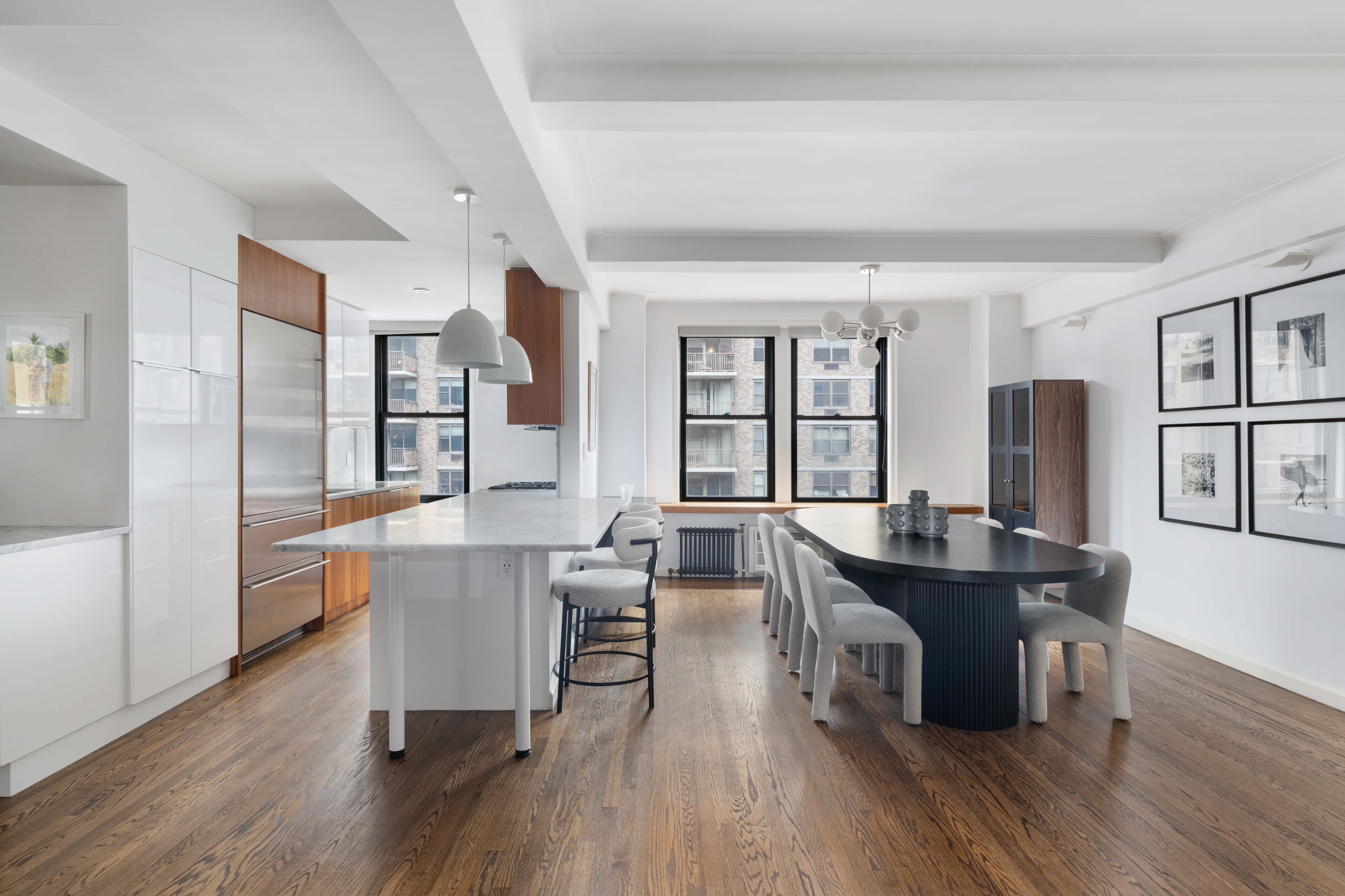 308 East 79th Street, Unit 13EF Manhattan, NY 10075 - Photo 1 of 16 a view of a dining room with furniture and wooden floor
