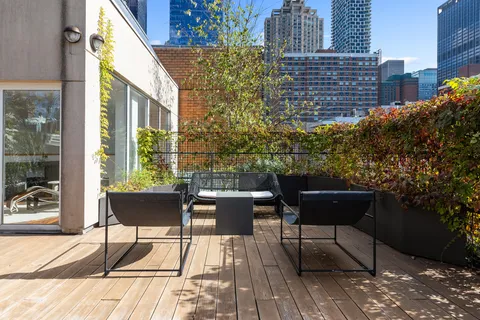 a building outdoor space with patio couch and outdoor seating