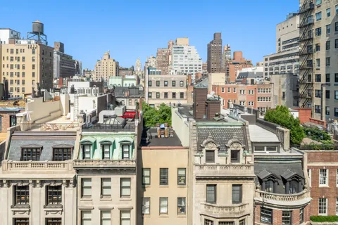 a view of city with tall buildings