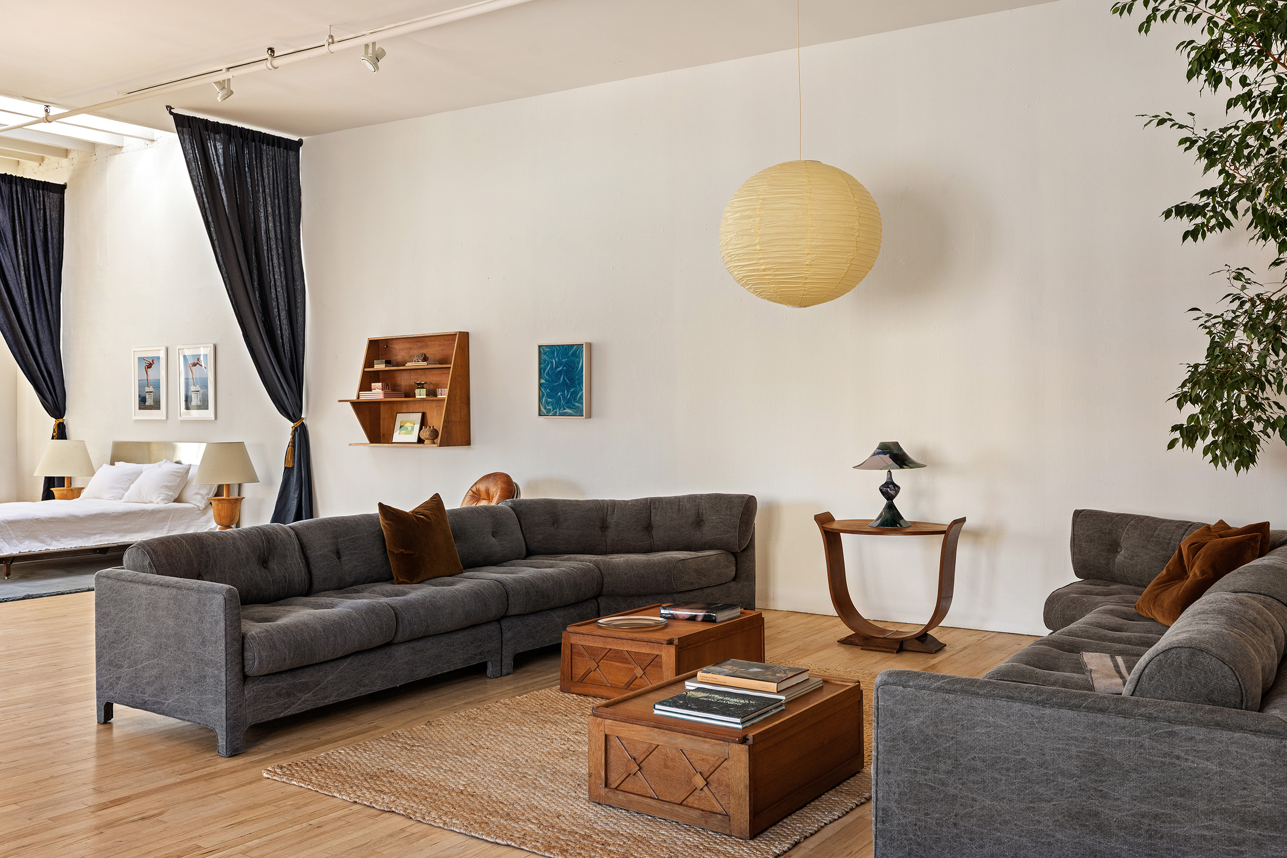 47 Howard Street, Unit PH Manhattan, NY 10013 - Photo 5 of 14 a living room with furniture and a potted plant