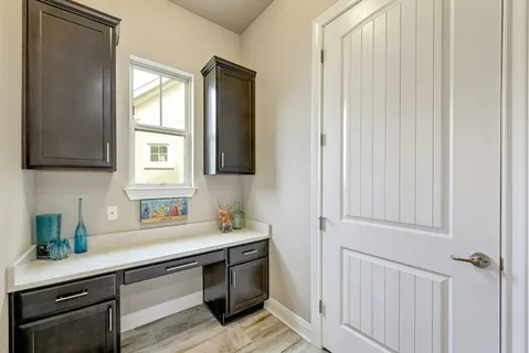 a kitchen with stainless steel appliances a sink stove and cabinets