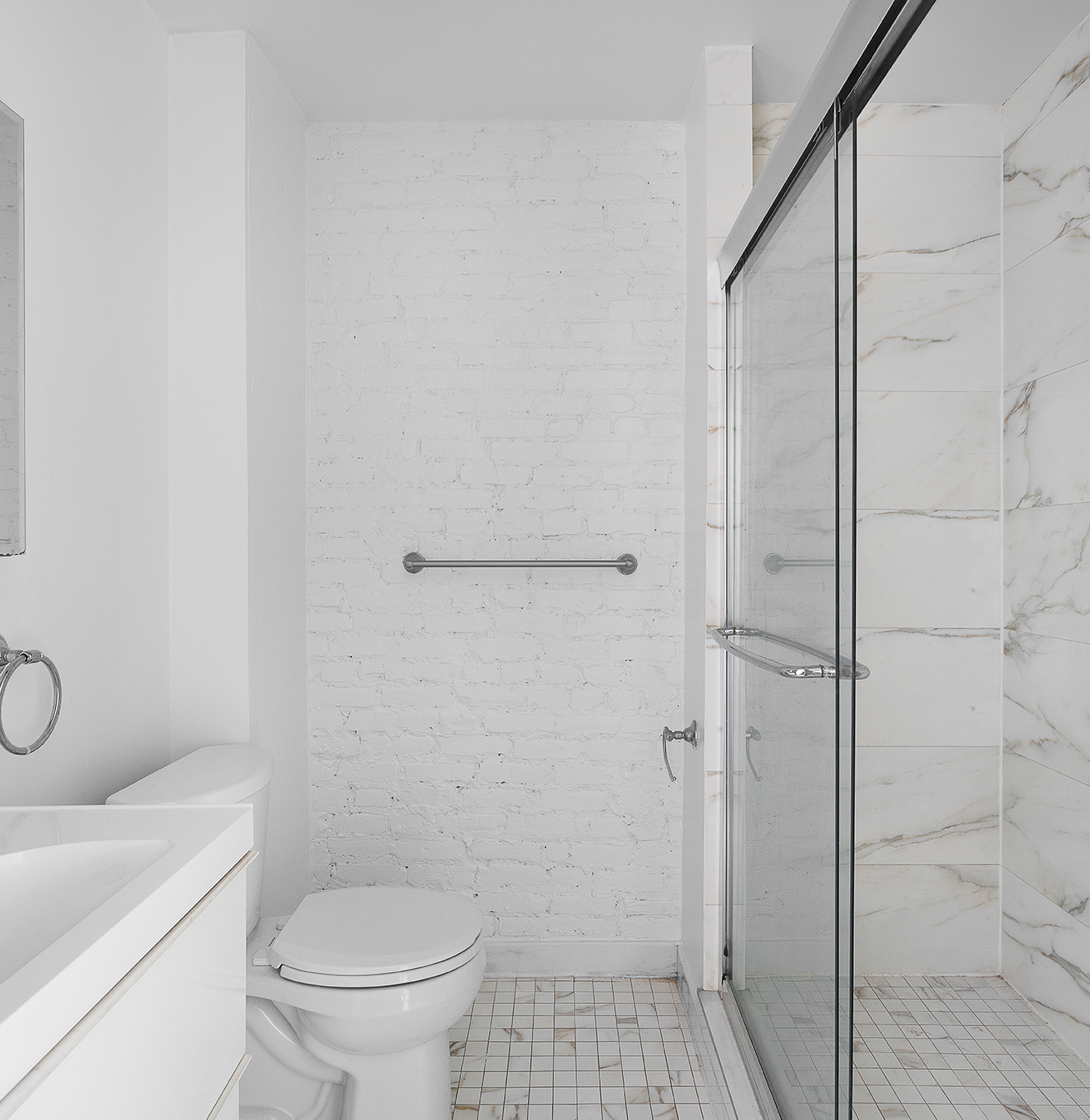 57 Grand Street, Unit 3 Manhattan, NY 10013 - Photo 5 of 6 a bathroom with a toilet and a shower