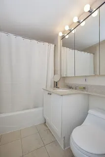 a bathroom with a sink a toilet and vanity