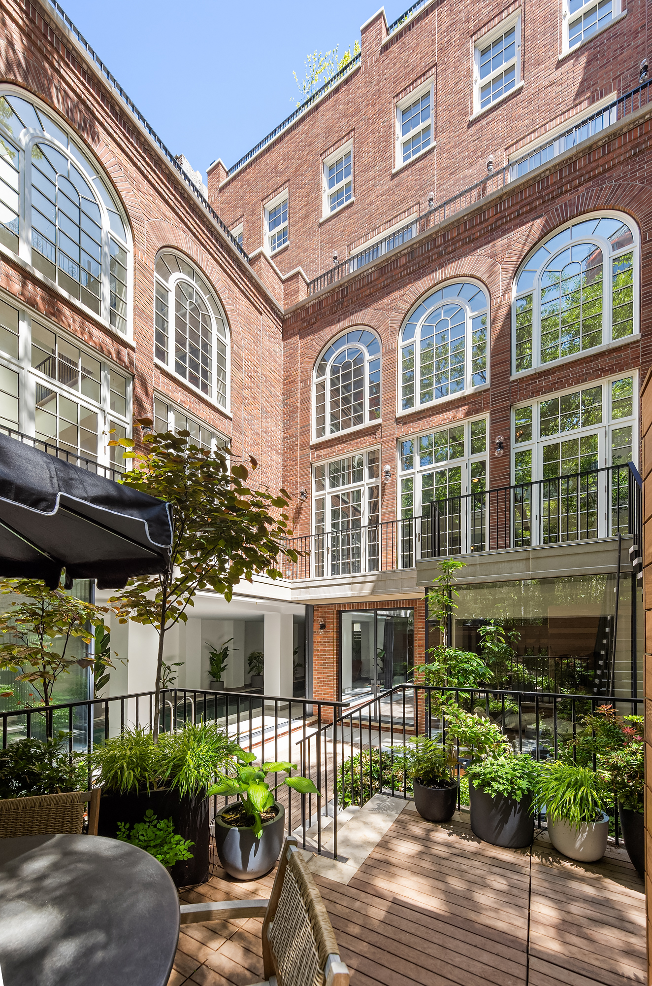 48-50 West 69th Street Manhattan, NY 10023 - Photo 29 of 33 a front view of a building with garden