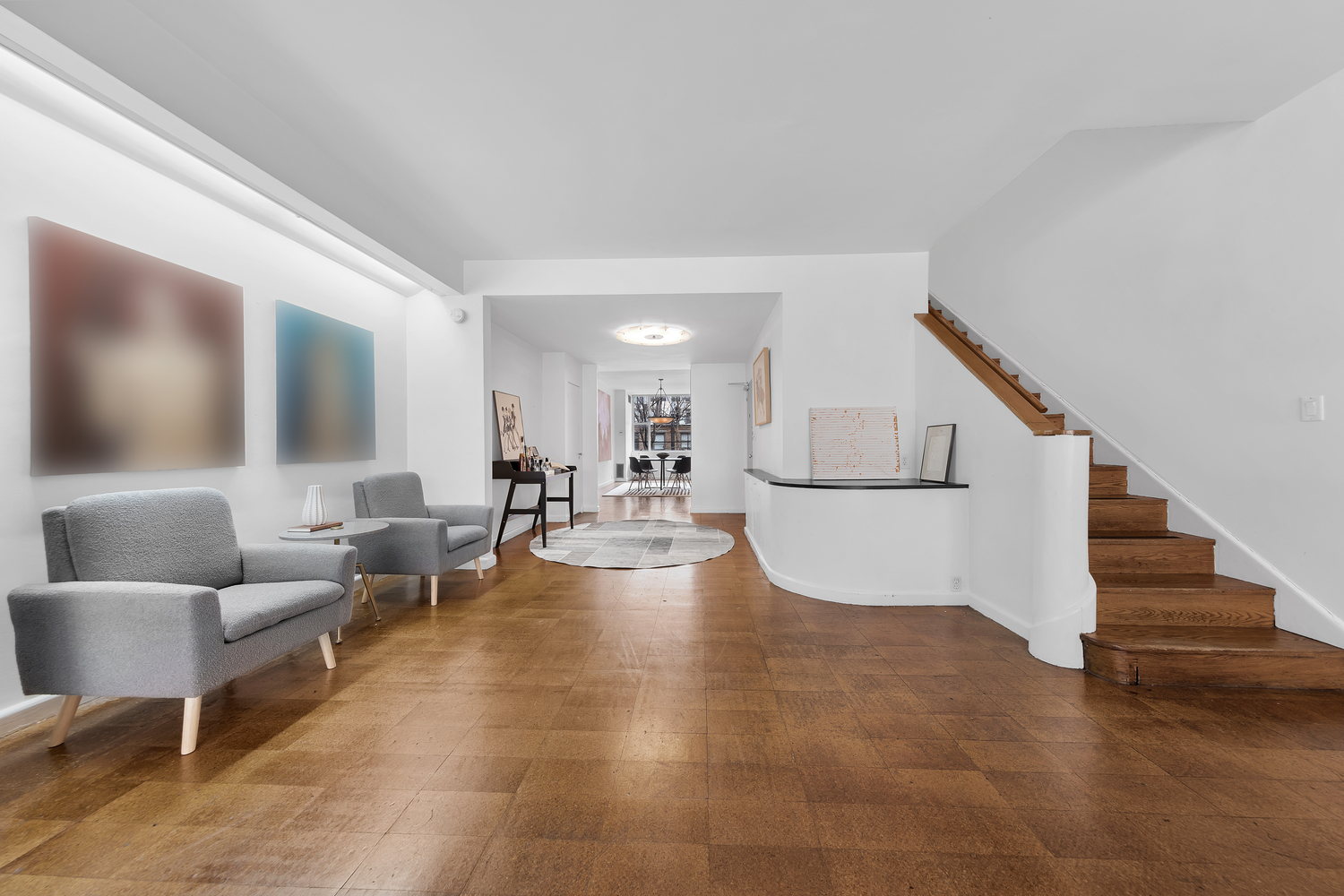 219 East 49th Street Manhattan, NY 10017 - Photo 4 of 19 a view of livingroom with furniture and stairs