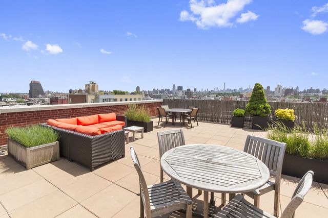 258 St Nicholas Avenue, Unit 3F Manhattan, NY 10027 - Photo 11 of 15 a view of a terrace with furniture and a table