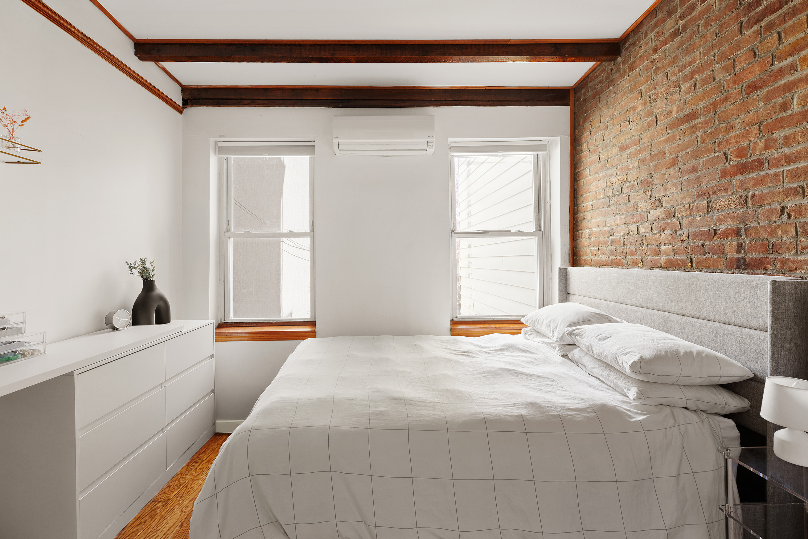 171 Monitor Street Brooklyn, NY 11222 - Photo 9 of 11 a bedroom with a bed and a large window