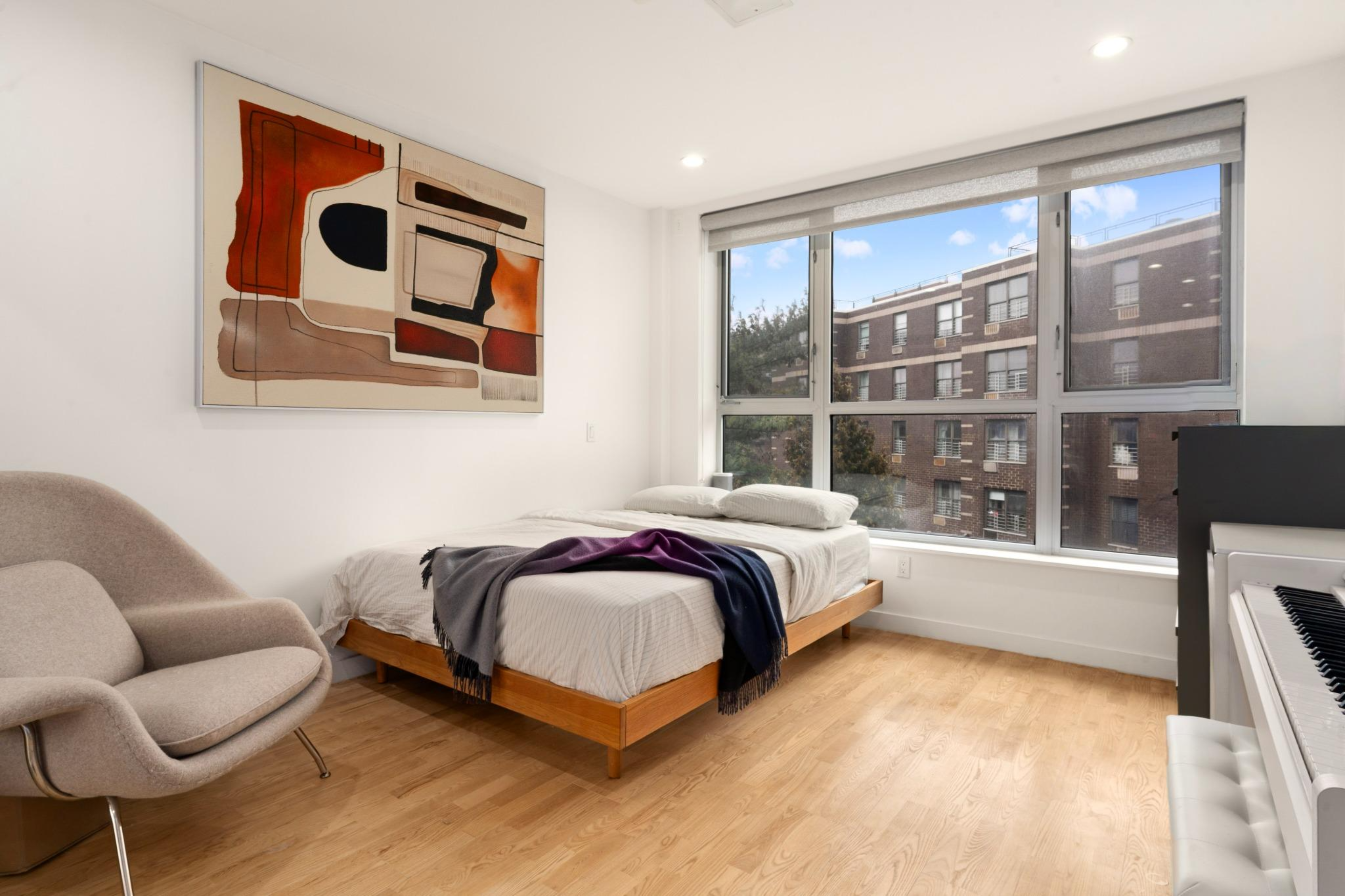 261 Union Avenue, Unit 4 Brooklyn, NY 11211 - Photo 5 of 13 a spacious bedroom with a bed and glass window