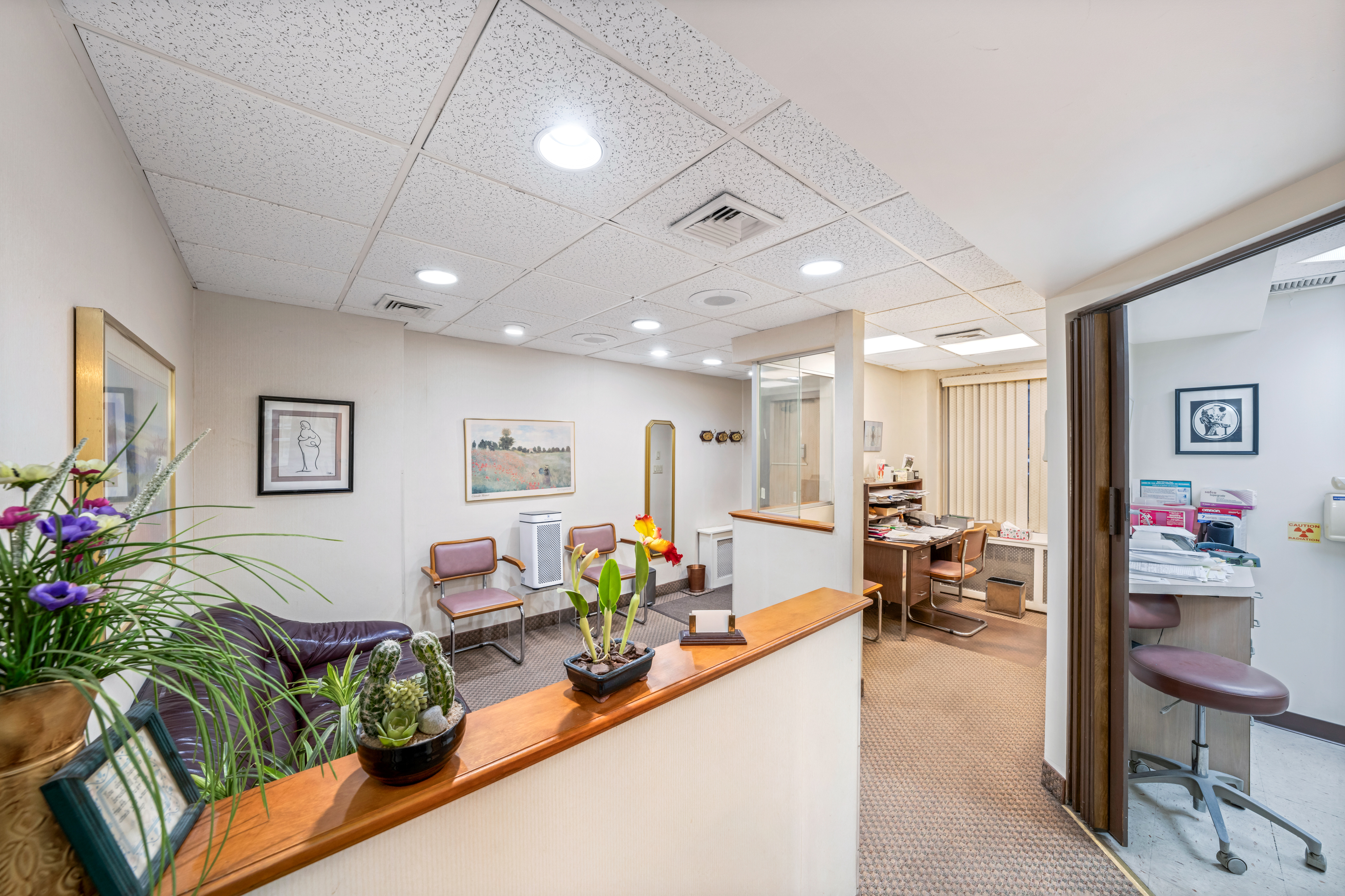 440 East 79th Street, Unit 1D Manhattan, NY 10075 - Photo 1 of 5 a living room with furniture and flowers