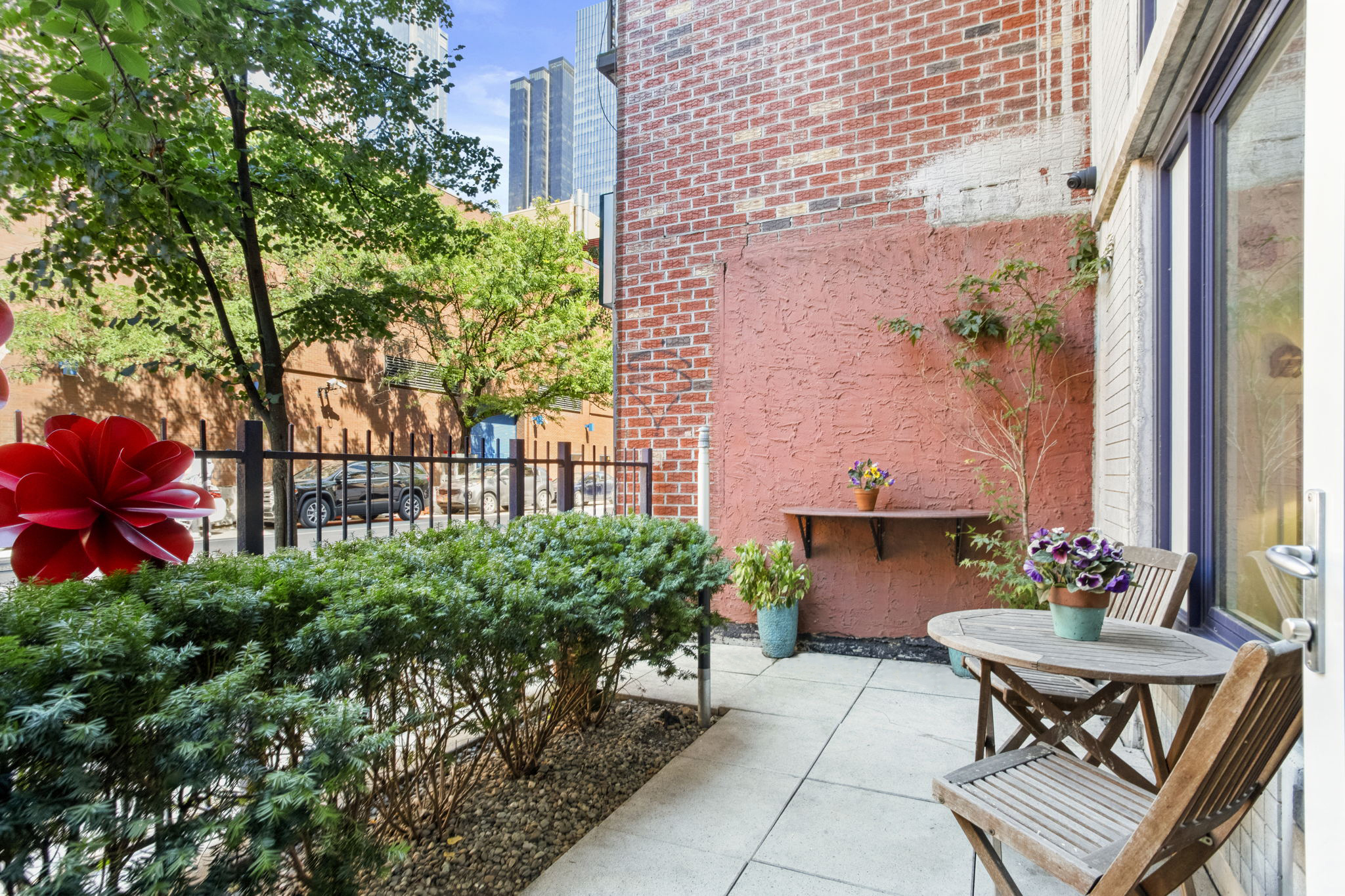 350 West 53rd Street, Unit THG Manhattan, NY 10019 - Photo 1 of 25 a view of a backyard with sitting area and garden
