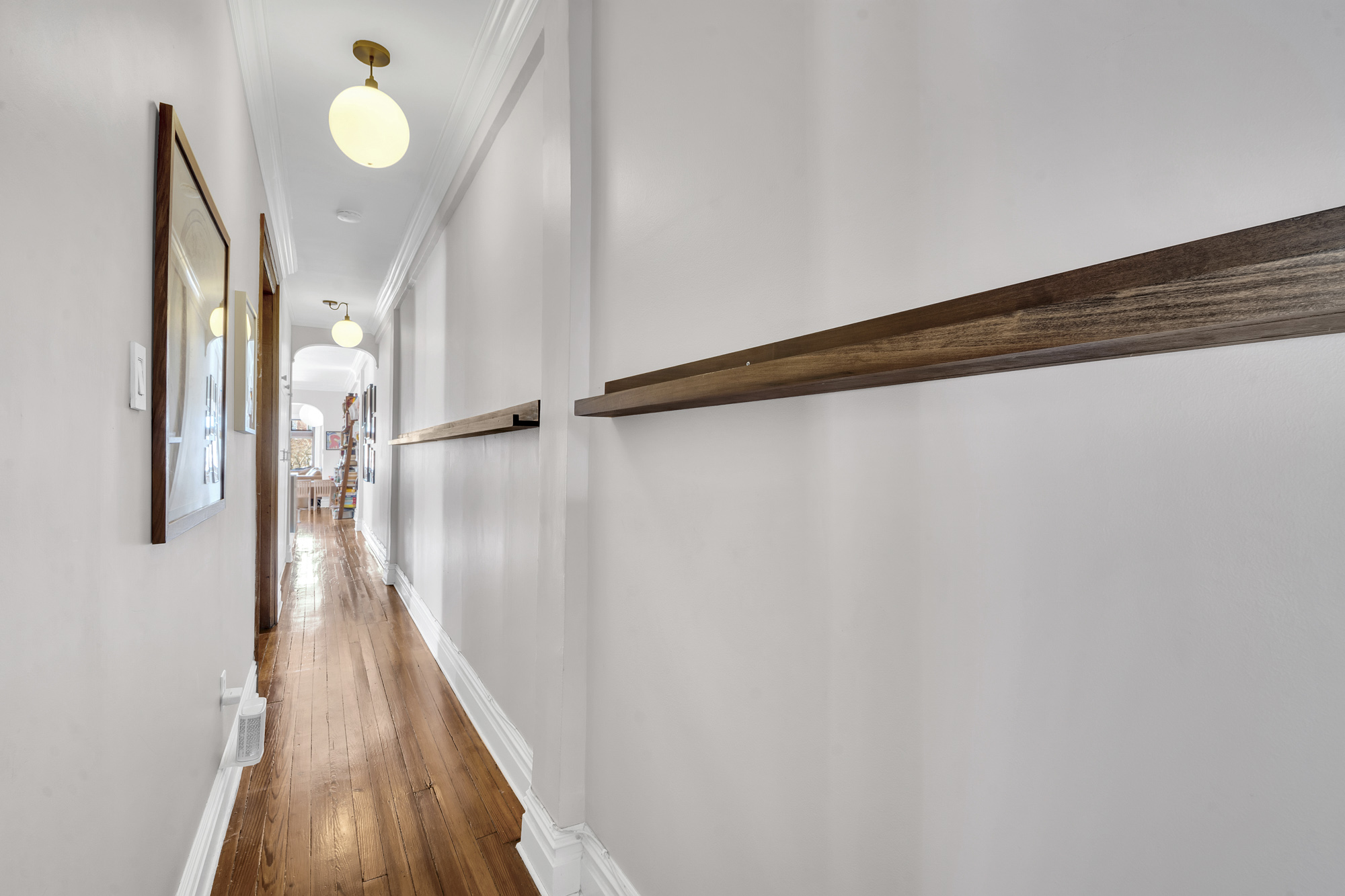 275 Clinton Avenue, Unit 4-1 Brooklyn, NY 11205 - Photo 10 of 20 a view of a hallway with wooden floor and staircase