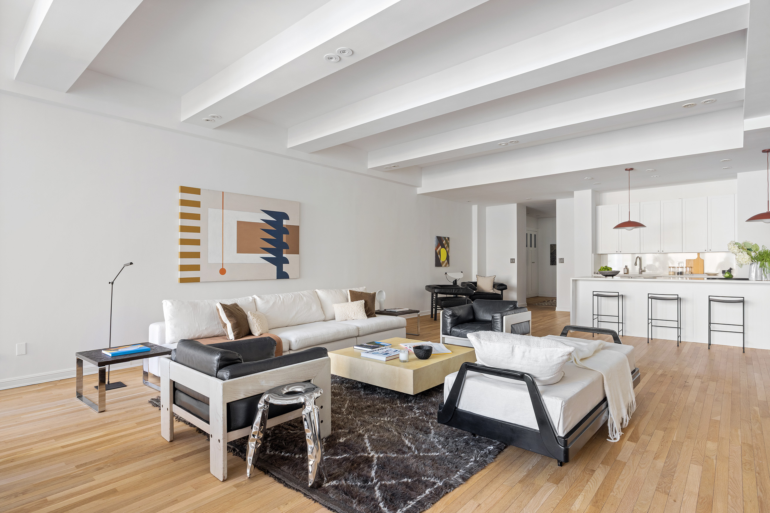 252 7th Avenue, Unit 9R Manhattan, NY 10001 - Photo 7 of 23 a living room with furniture and wooden floor