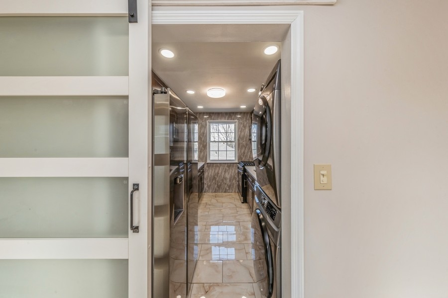224-46 Horace Harding Expressway, Unit 630 Queens, NY 11364 - Photo 13 of 29 a view of a hallway with a livingroom and furniture