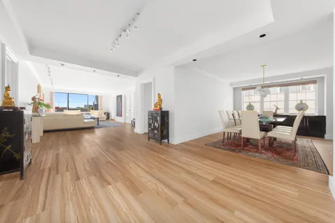 a workspace with furniture window and wooden floor