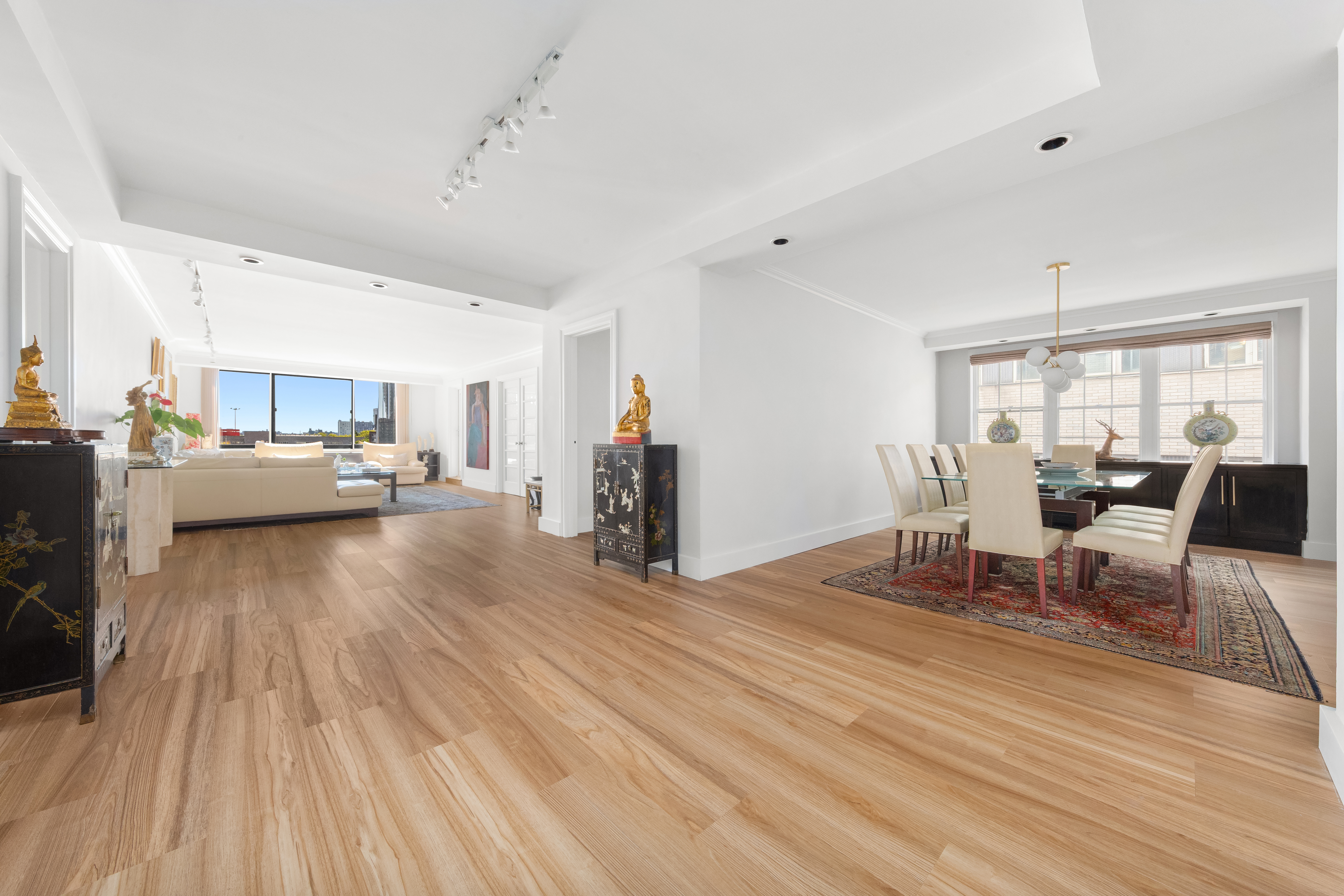 530 East 72nd Street, Unit 4F Manhattan, NY 10021 - Photo 4 of 23 a living room with furniture and a wooden floor