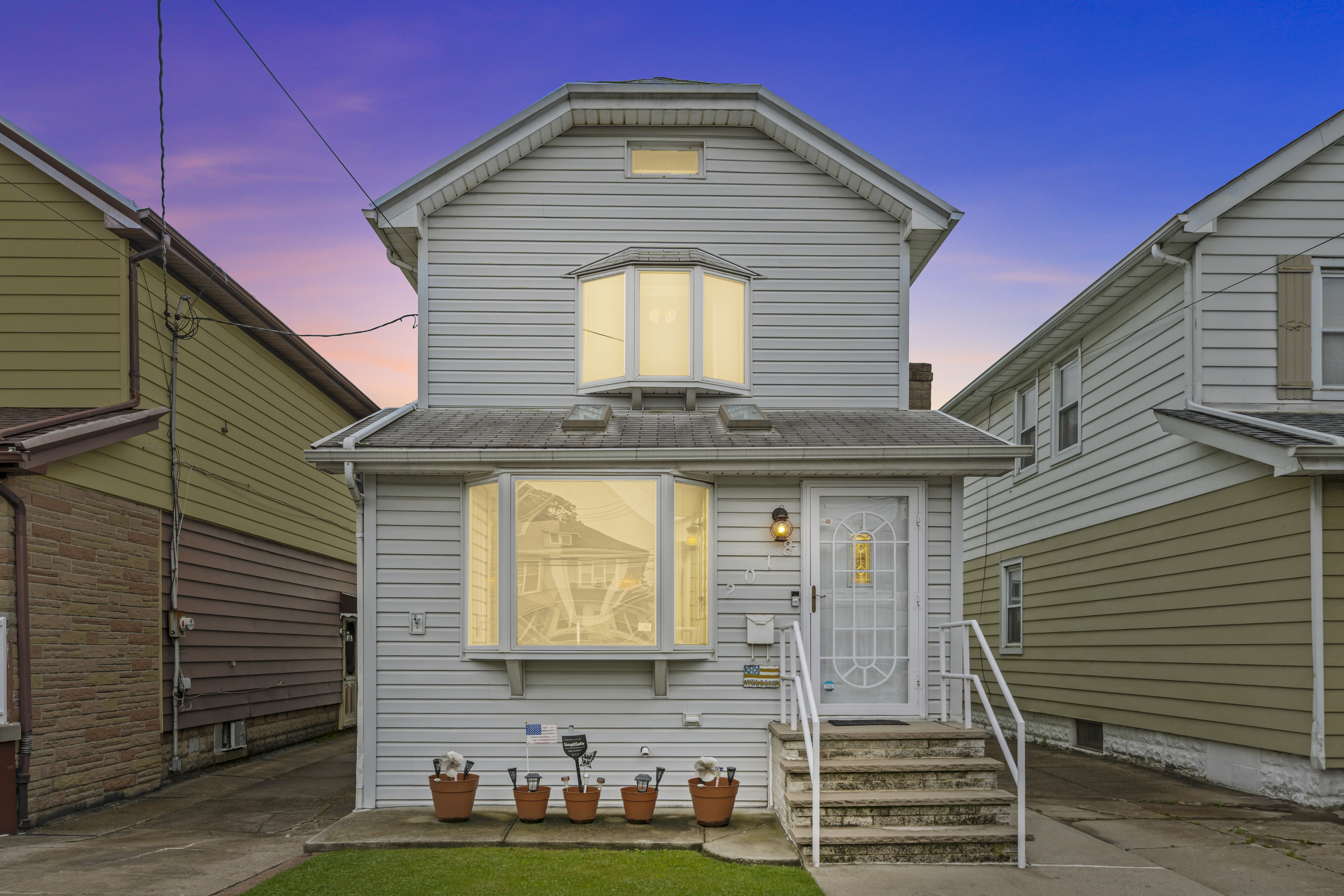 a front view of a house with garden