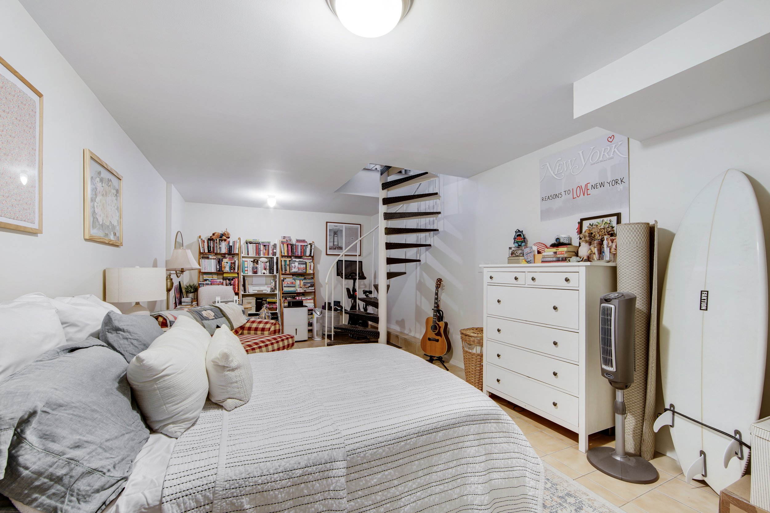 417 East 90th Street, Unit 1G Manhattan, NY 10128 - Photo 6 of 10 a bed room with a bed and a dresser