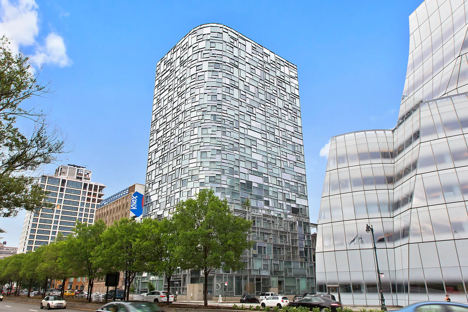 a tall building sitting next to a street