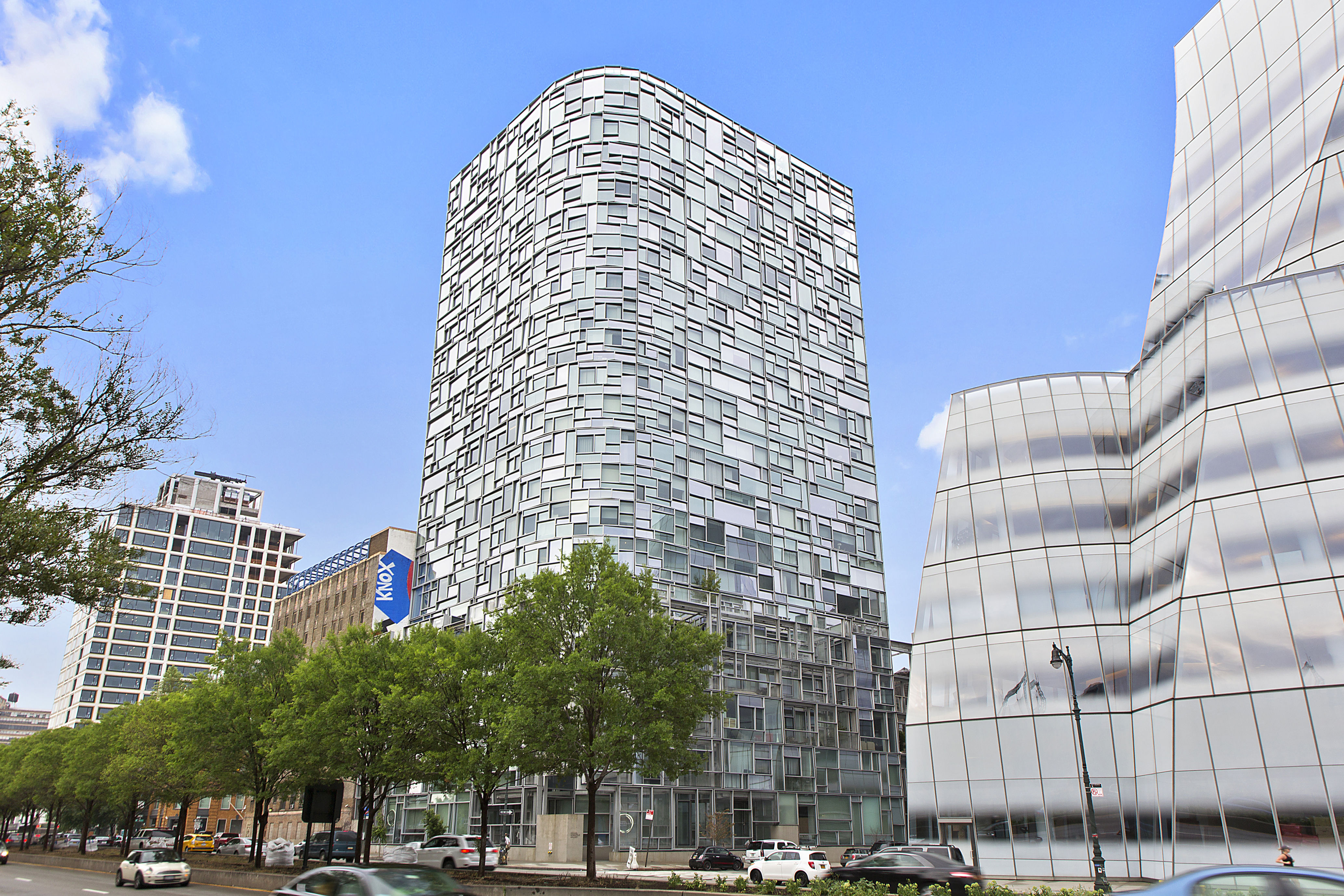 100 11th Avenue, Unit 9D Manhattan, NY 10011 - Photo 15 of 17 a tall building sitting next to a street