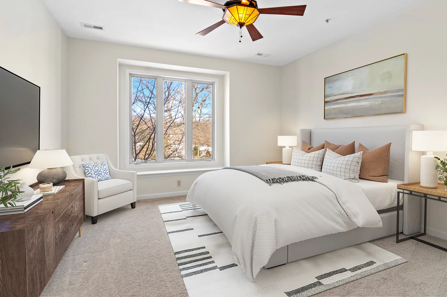 a bedroom with a large bed and a couch