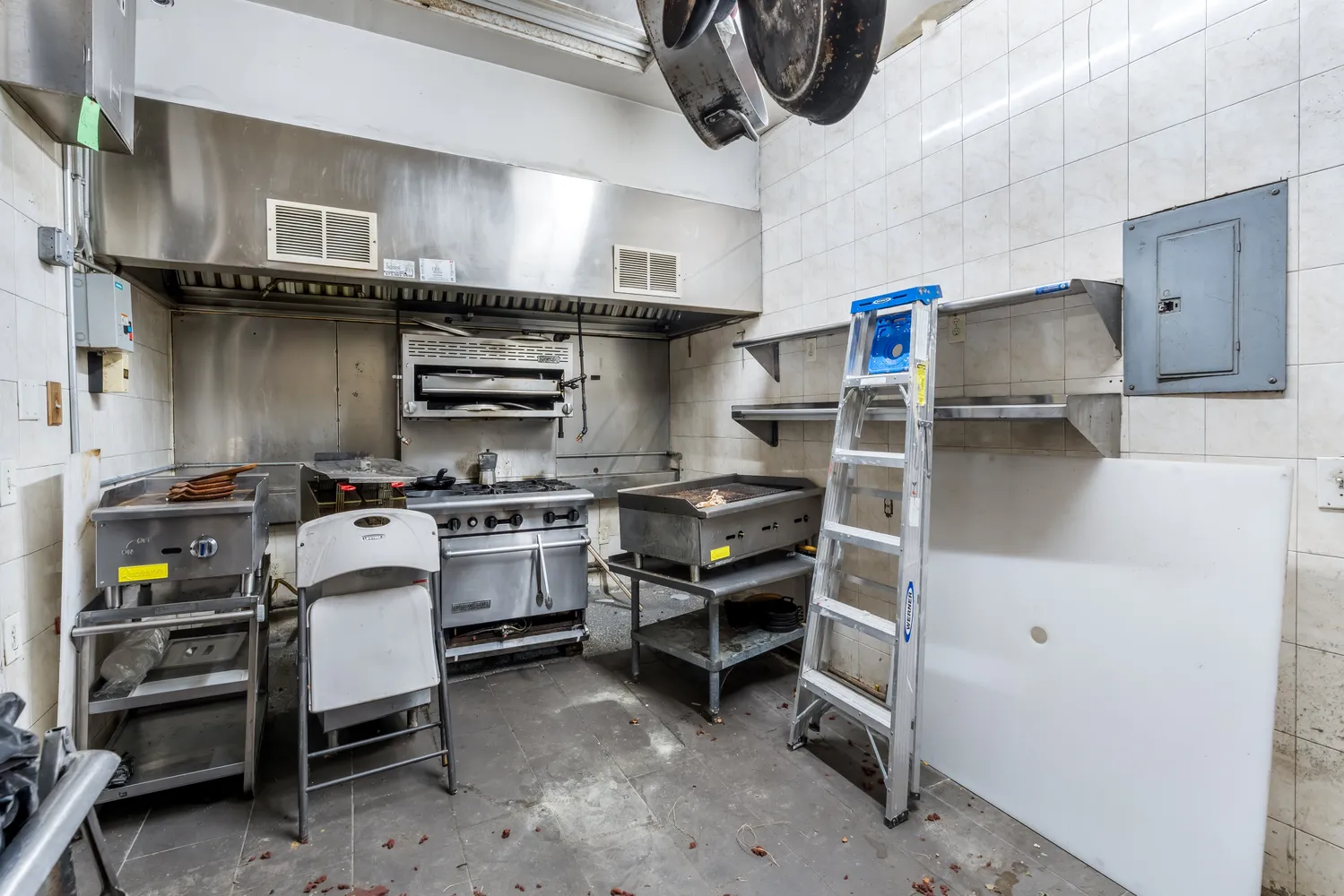 a kitchen with a stove and a refrigerator