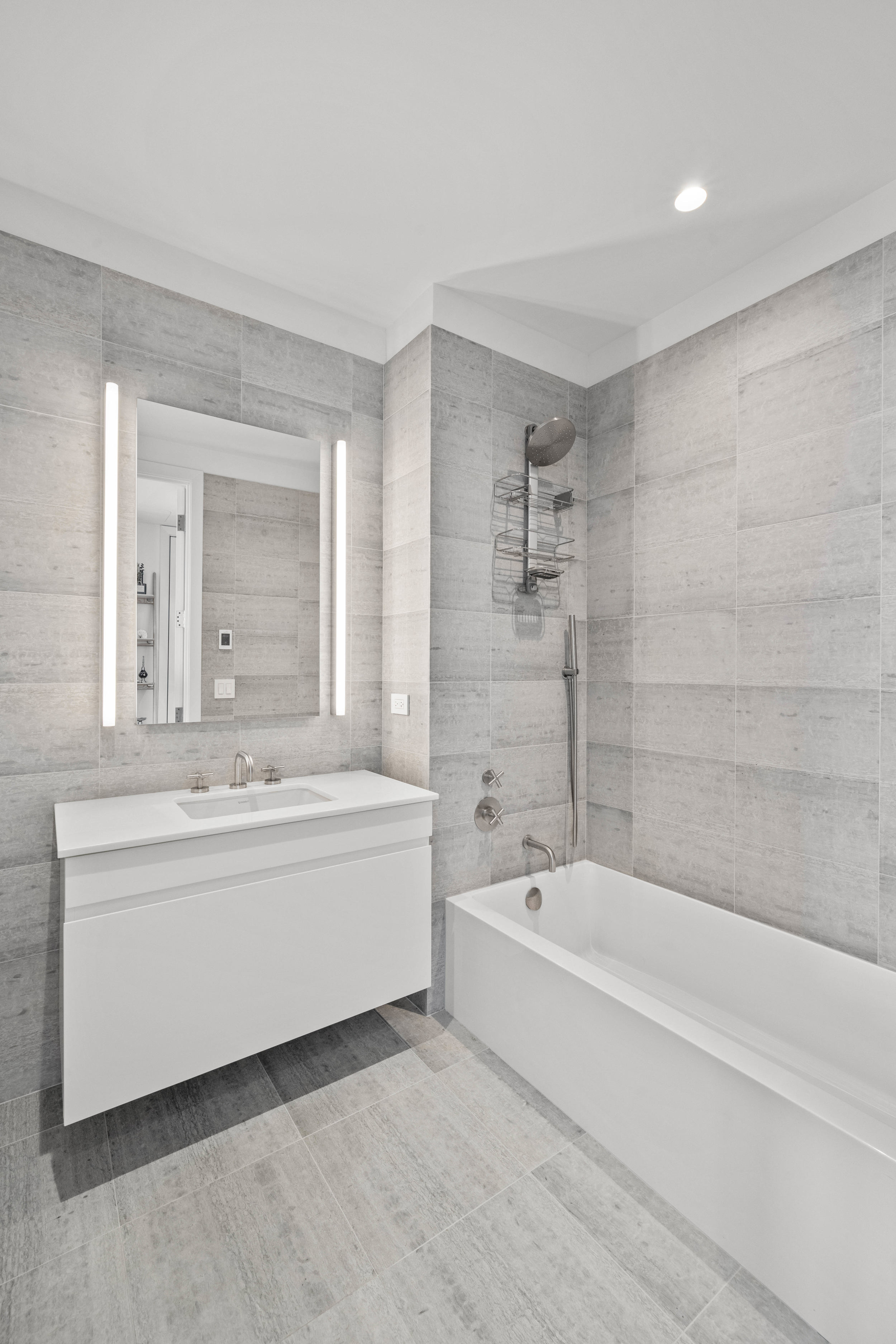 8 South 4th Street, Unit 15D Brooklyn, NY 11249 - Photo 9 of 29 a bathroom with a bathtub and a sink