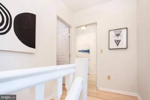 a view of a bathroom with a shower and a mirror
