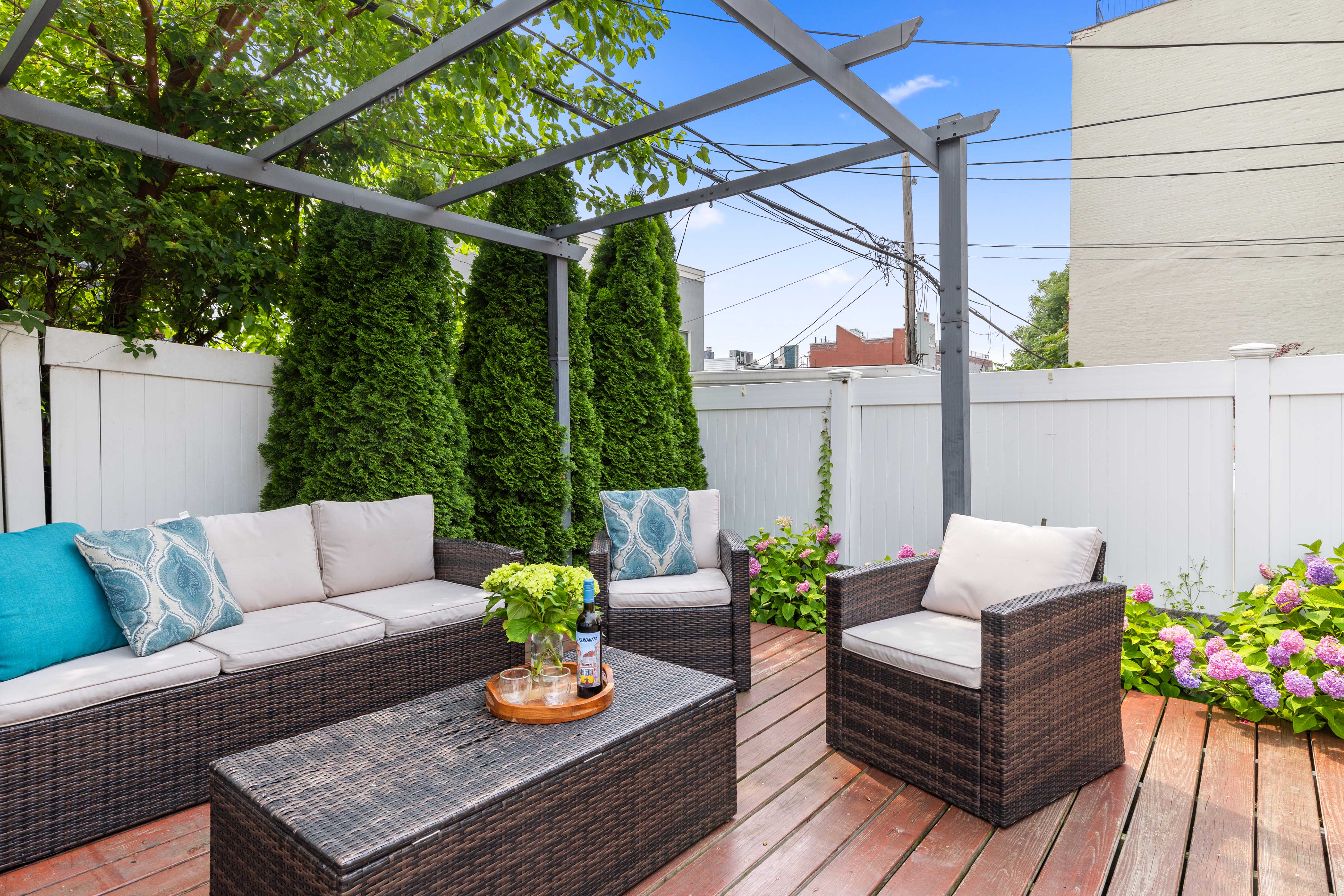 266 18th Street Brooklyn, NY 11215 - Photo 11 of 20 a outdoor living room with furniture and a potted plant