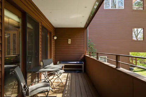 a view of balcony with chairs