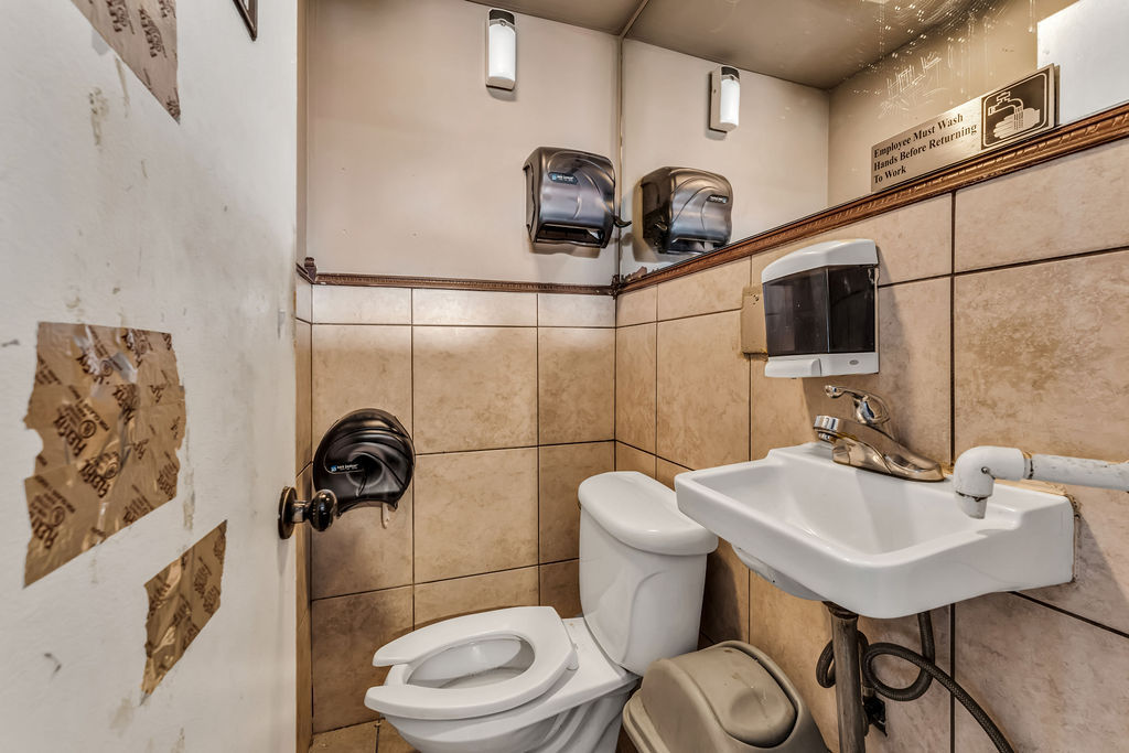 601-603 Washington Street, Unit RESTAURANT Hoboken, NJ 07030 - Photo 17 of 27 a bathroom with a sink a toilet and a mirror